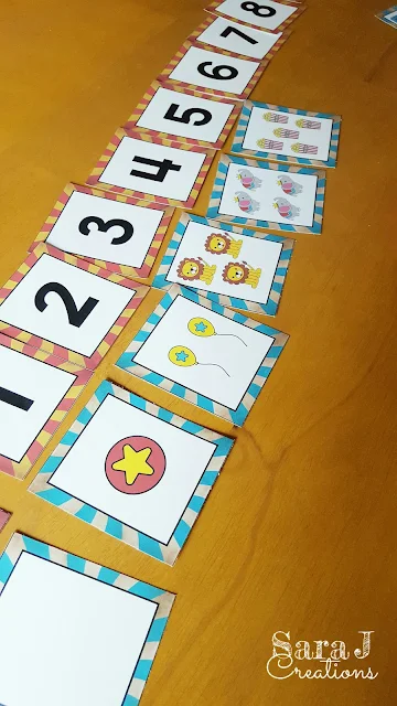 Matching numbers and the circus pictures that show the same amount.