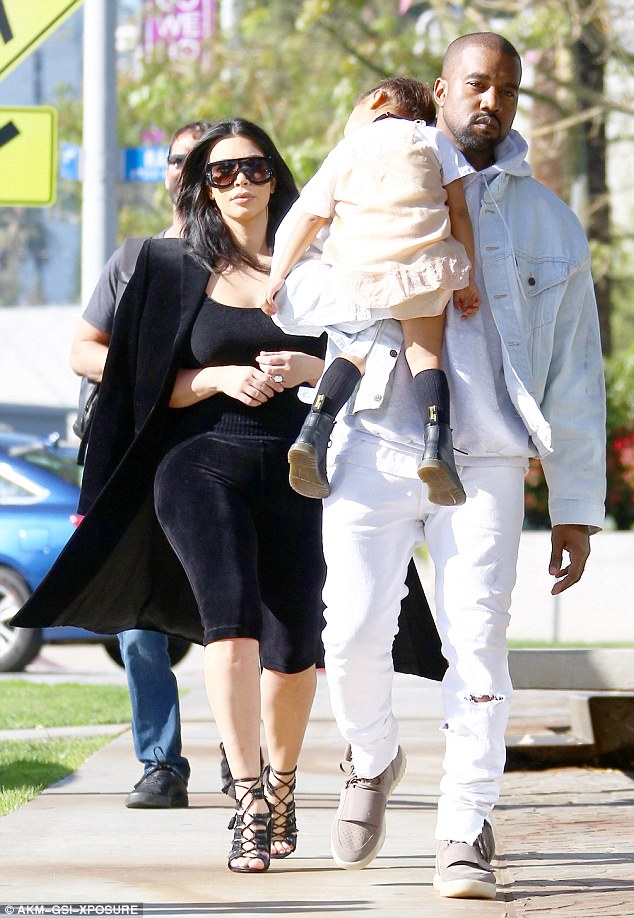 Kachi Zone's Blog Kanye West carries sleeping North West as he and Kim