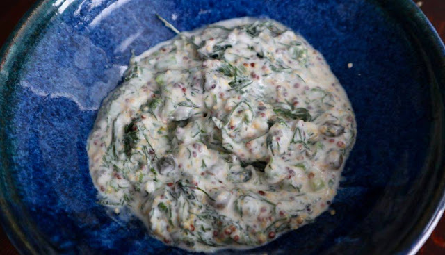mixture of dill, yogurt, mustard, and capers in a hand made bowl