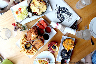 Chicken ‘n’ Watermelon ‘n’ Waffles, honey hot sauce, chilled spiced watermelon, cheddar cheese chow chow waffle, bourbon maple syrup at Yardbird Southern Table & Bar Chicken ‘n’ Watermelon ‘n’ Waffles, honey hot sauce, chilled spiced watermelon, cheddar cheese chow chow waffle, bourbon maple syrup at Yardbird Southern Table & Bar