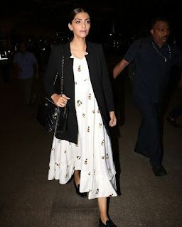 Sonam Kapoor Without Makeup in a White Long Dress at Airport June 2018