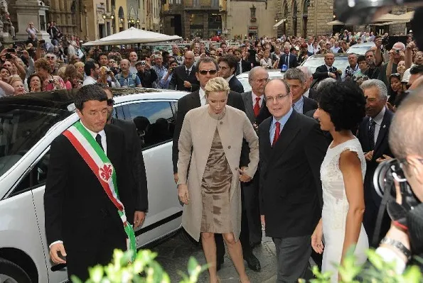 Prince Albert and Princess Charlene visited Palazzo Vecchio. Princess Charlene wore Elie Saab gold dress