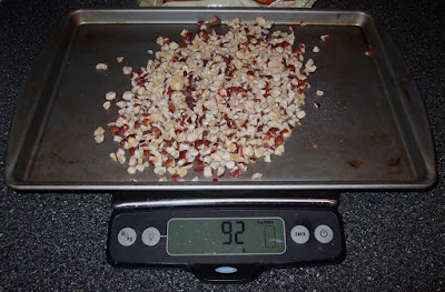 Chopped hazelnuts on baking sheet.