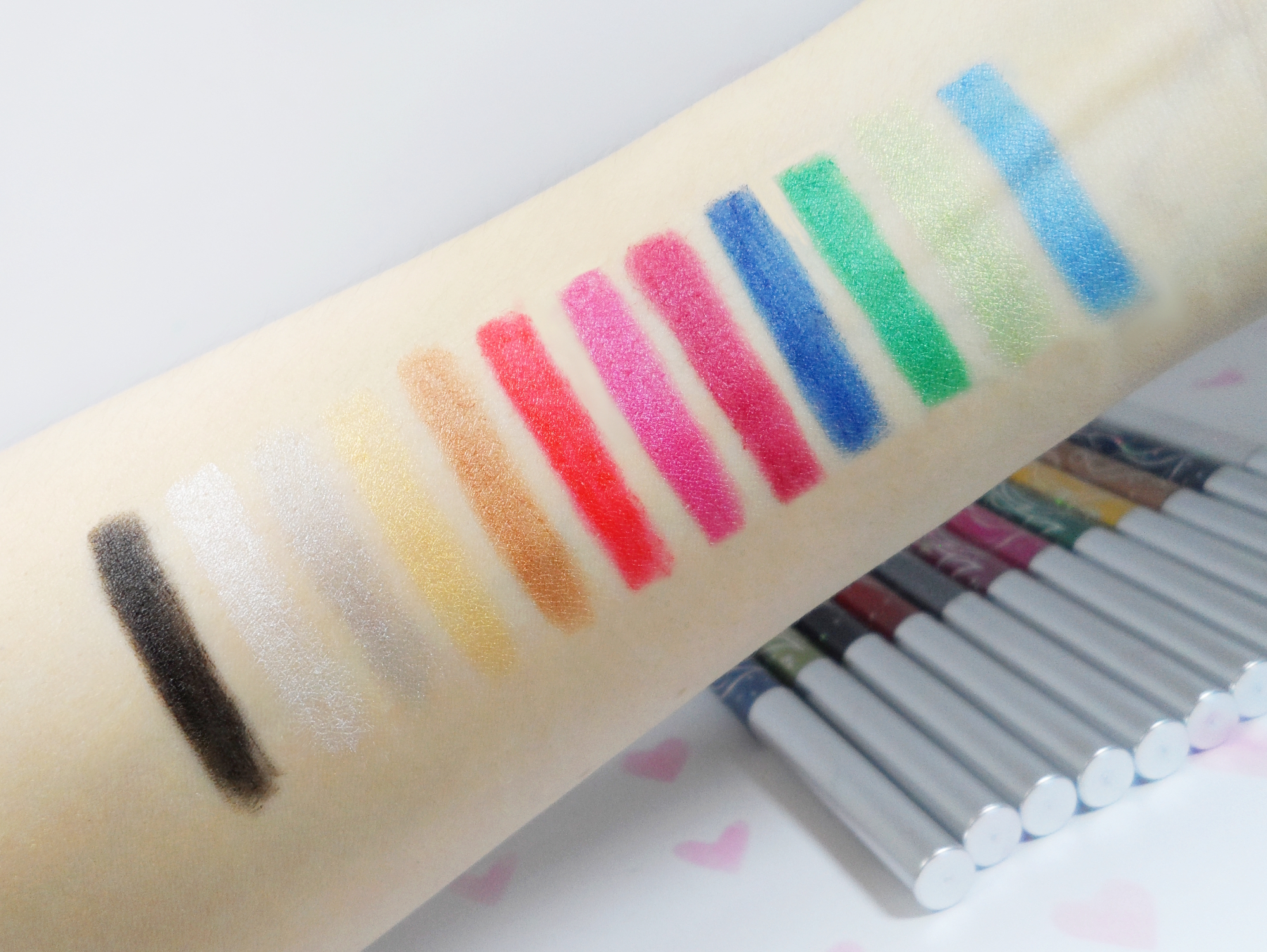swatches of the cheap makeup pencils on a light skin