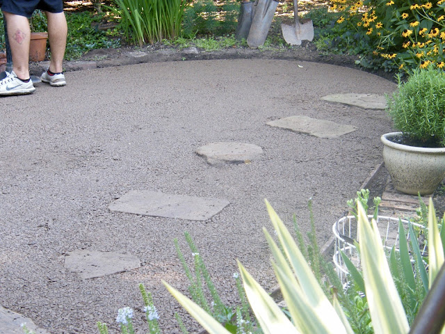 Compacted gravel and stepping stones is handsome without grass!