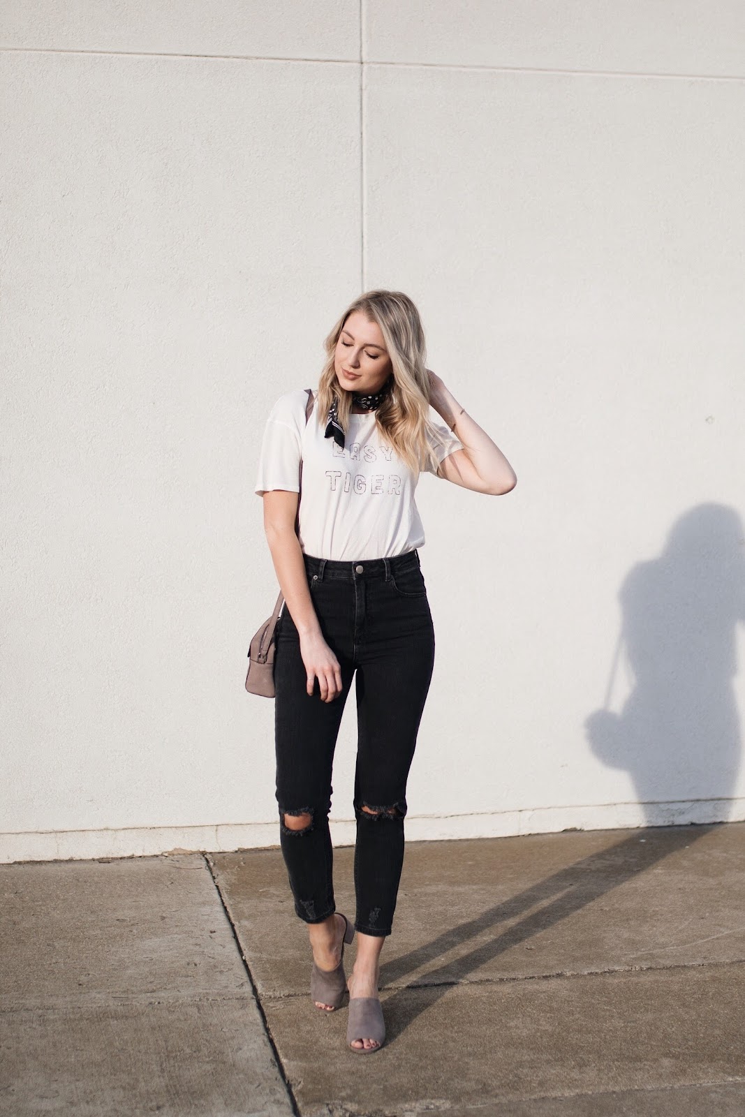 high-waisted "mom" jeans, graphic tee, heeled mules