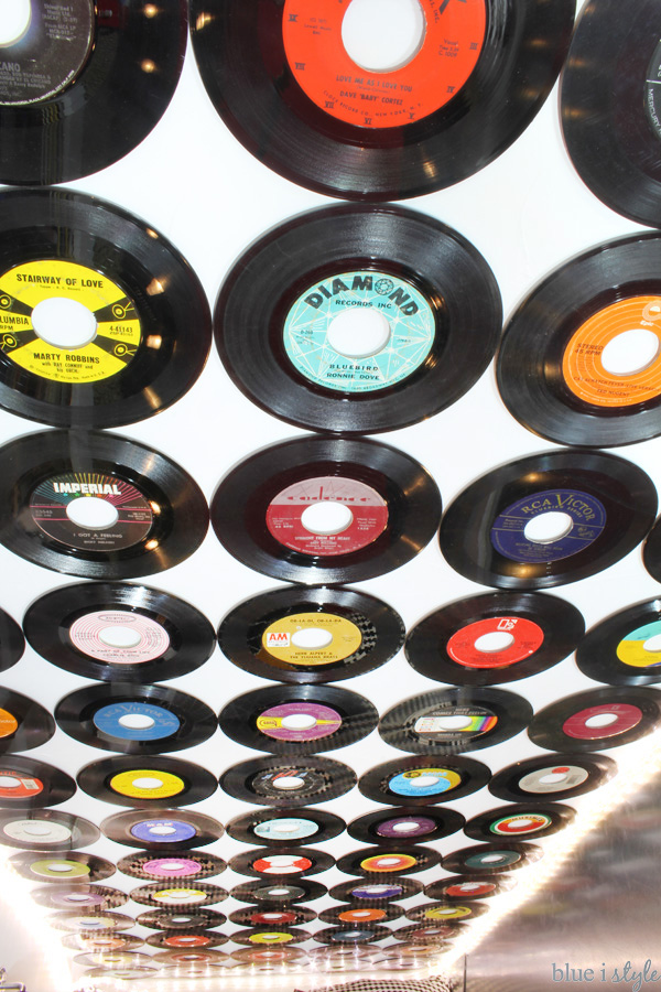 A wall covered in vinyl records