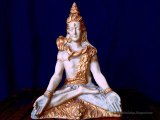 lord Shiva Mini Statue On The Table With Blue Background