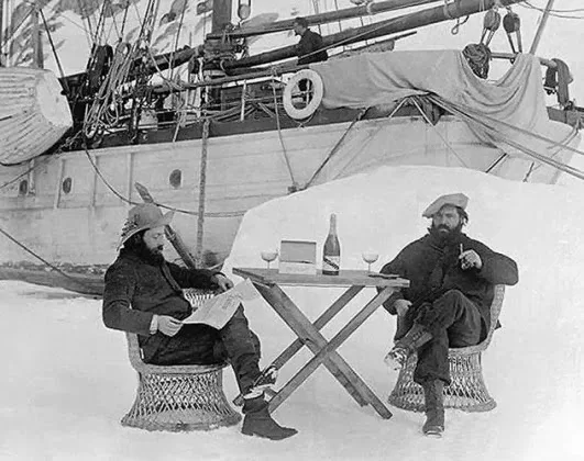 French Antarctica expeditionist J.B. Charcot (left) and Raymond Rallier du Baty drinking Mumm Champagne in Antarctica, Bastille Day 1904