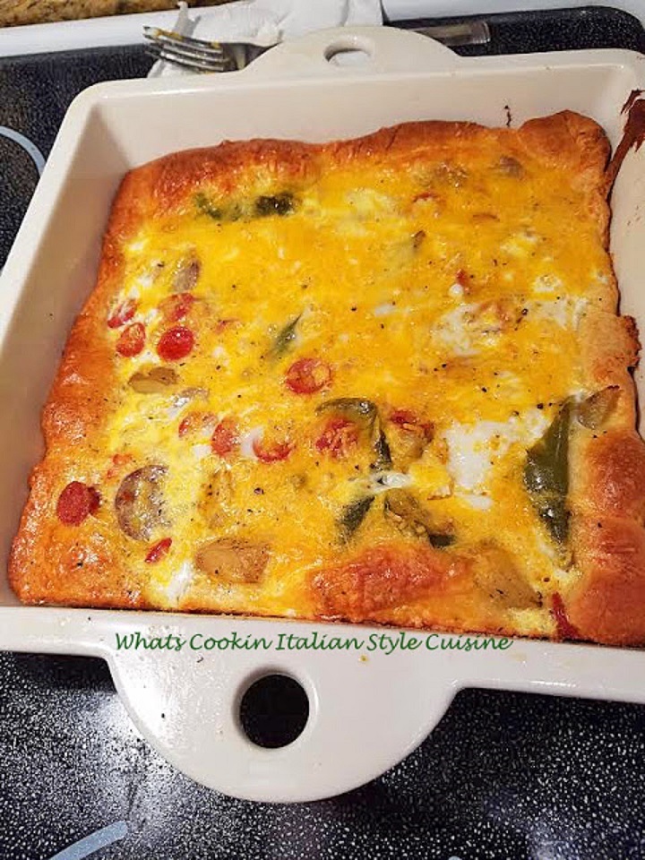 Crescent Roll Breakfast Pizza are rolls on the bottom baked with delicious meat and vegetable toppings. Sausage, potatoes, peppers, onions, tomatoes, bacon, ham  then with eggs poured over the topped and baked into a golden breakfast pizza with lots of shredded cheeses