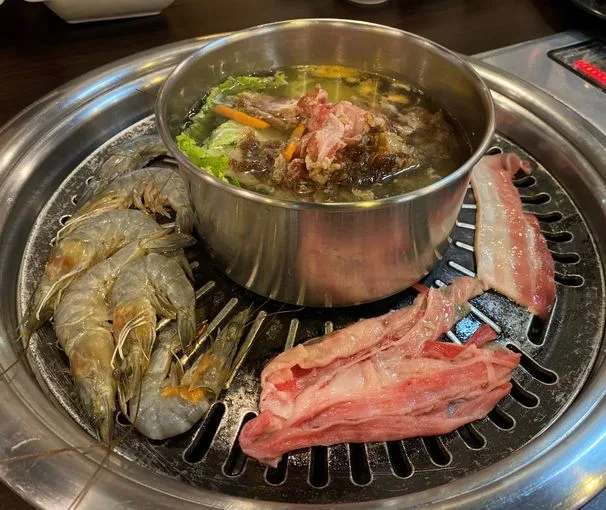 Shrimp, meat, and beef bulgogi soup on the grill at All4U Unlimited Grill & Shabu Shabu