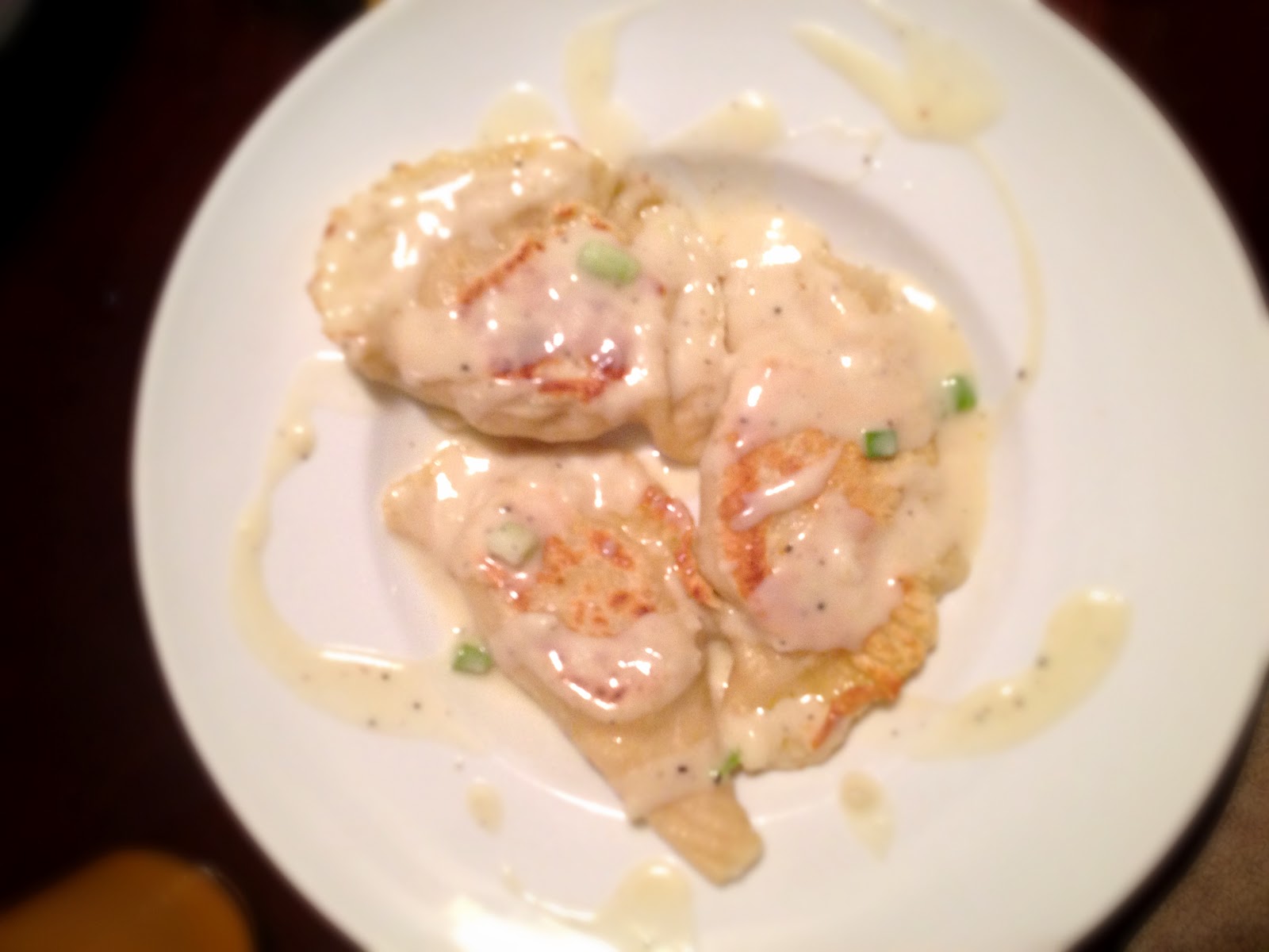 Potato and Cheese Pierogi with Sour Cream GarlicChive Sauce