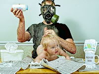changing the baby while wearing a gas mask