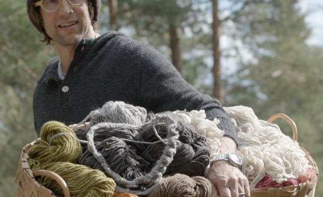 Janne carrying a basket of Myssyfarmi wool