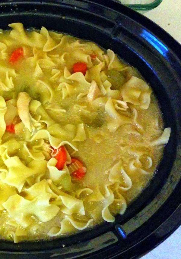 Slow Cooker Chicken Noodle Soup. This homemade recipes is creamy and simple. One of the easy comfort foods you can set-and-forget in the morning crockpot. Made with carrots, onions and celery. But you can add any other veggies to your liking. Try it with low carb noodles.