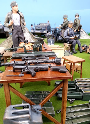 1/6 scale table of ammunition in diorama of an army post on display at a scale model exhibition.
