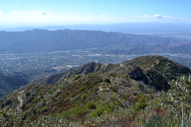 ridge with road and trail carved in the side