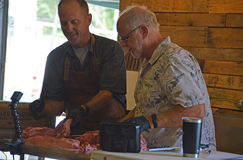 Grilling expert, Chris Grove, teaching a steak grilling class.