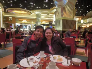 A couple travel blogger eating breakfast buffet at Cafe Deco at The Venetian Hotel in Macau