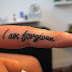 I am forgiven ink tattoo on side finger