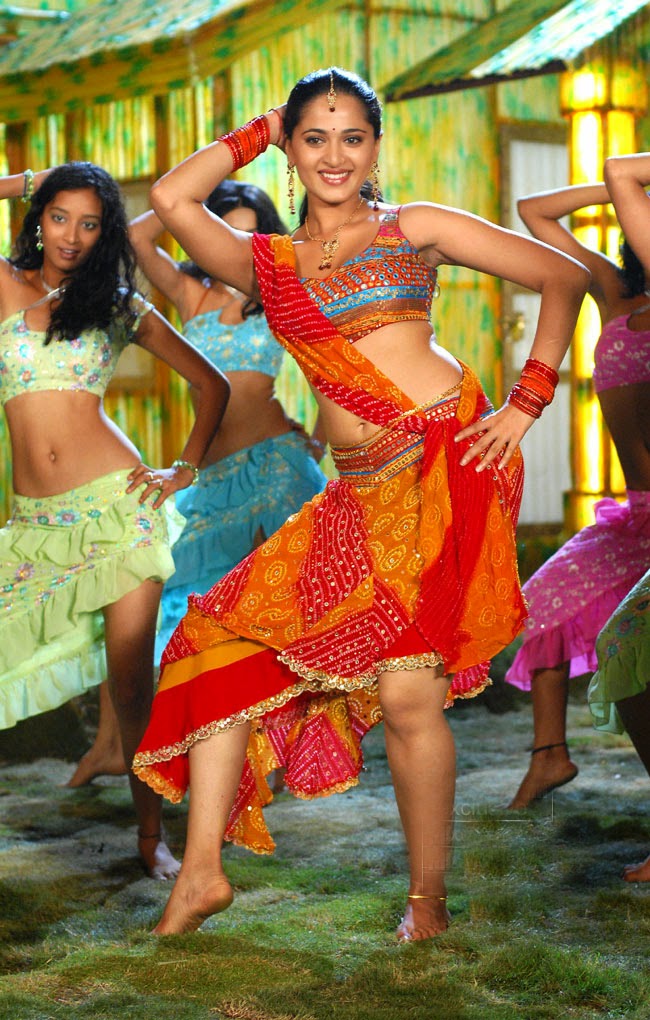 Anushka Shetty Hot Hip Navel Show Photos In Orange Top Lehenga