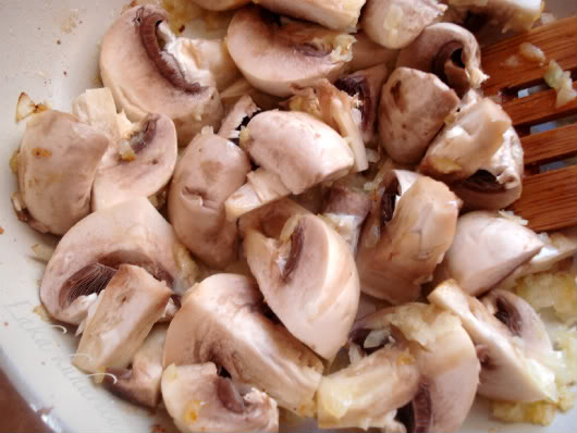 sliced button mushrooms in butter