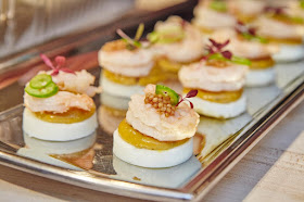Jay D's Lousiana Molasses Mustard Deviled Eggs topped with pickled shrimp, pickled mustard seeds and Serrano peppers