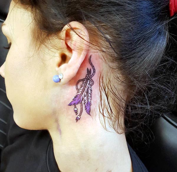 That is so cool and pretty native American style feathers tattoo designs for girls behind the ear