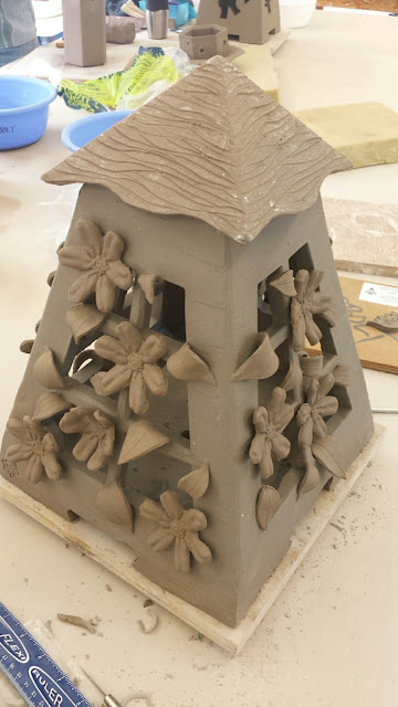 Pottery lantern with clematis design in progress by Lily L.