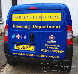 Back of Farleys Furniture van advertising the flooring department.