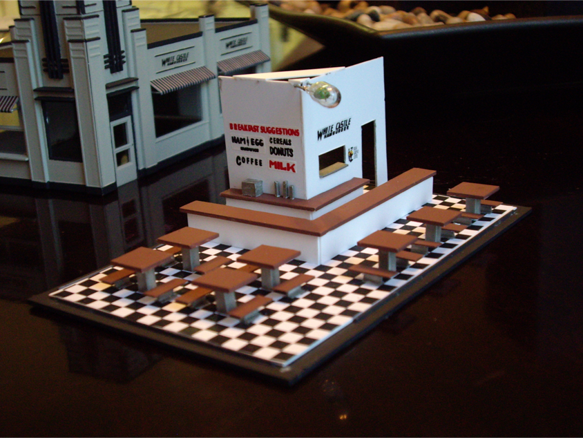 Custom interior scene consisting of counters, tables, and a black and white checkered floor for a White Castle kit