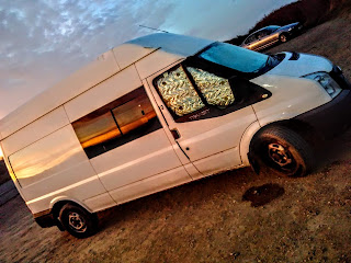 camper van at sunrise, on the cliffs, Widemouth Bay