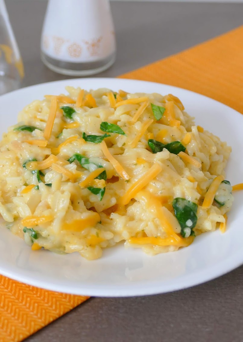 A delicious and easy side that's great served with chicken, beef or fish! Tons of flavor and ready in less than 20 minutes! Cheesy Spinach Rice and Orzo Recipe