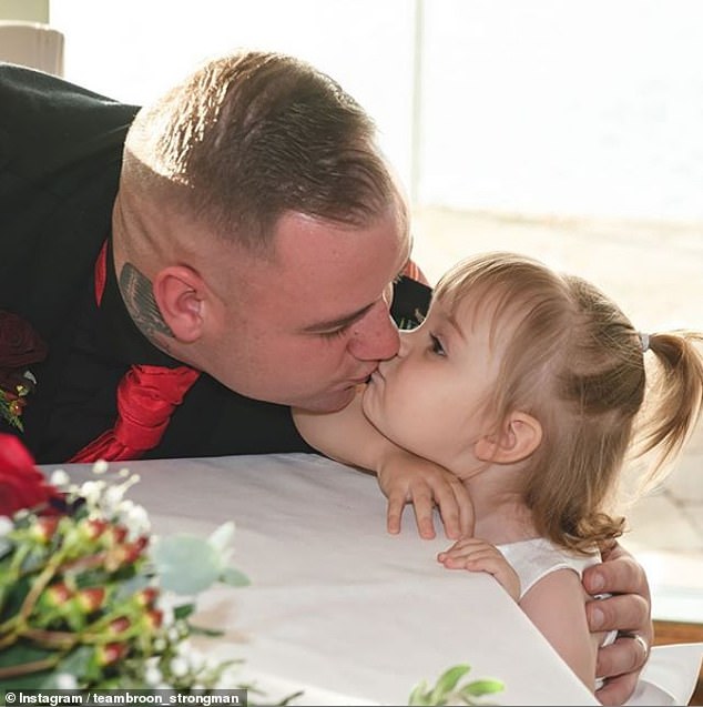 Defiant dad posts viral photo of him kissing his daughter, six