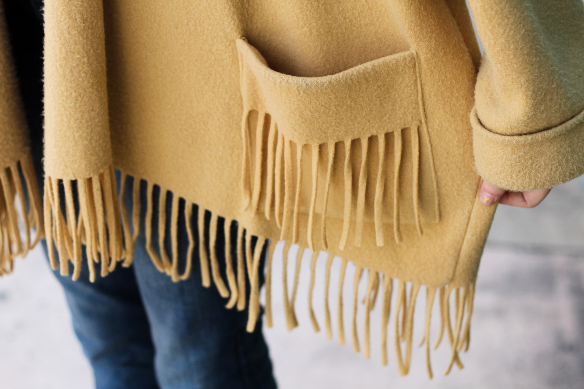 cozy in camel colored fringes.