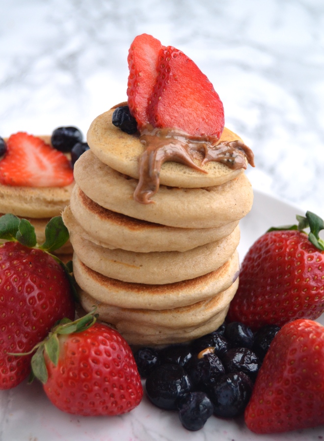 Toddler Mini Whole-Grain Pancakes are easy to make and nutritious! Make a large batch and freeze for easy breakfasts and snacks for toddlers! Gluten-free and made with oats.
