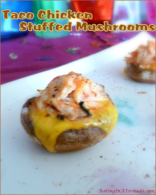 Taco Chicken Stuffed Mushrooms, a bite sized appetizer packed with chicken taco flavor. Simple to make, fun to share. | Recipe developed by www.BakingInATornado.com | #recipe #appetizer