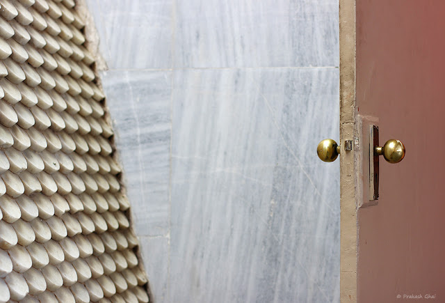  A Minimalist Photograph of Two Golden Door Knobs shot at Jawahar Kala Kendra, Jaipur.