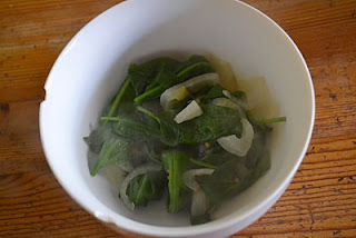 Leaves cooked with onions in tomato juice
