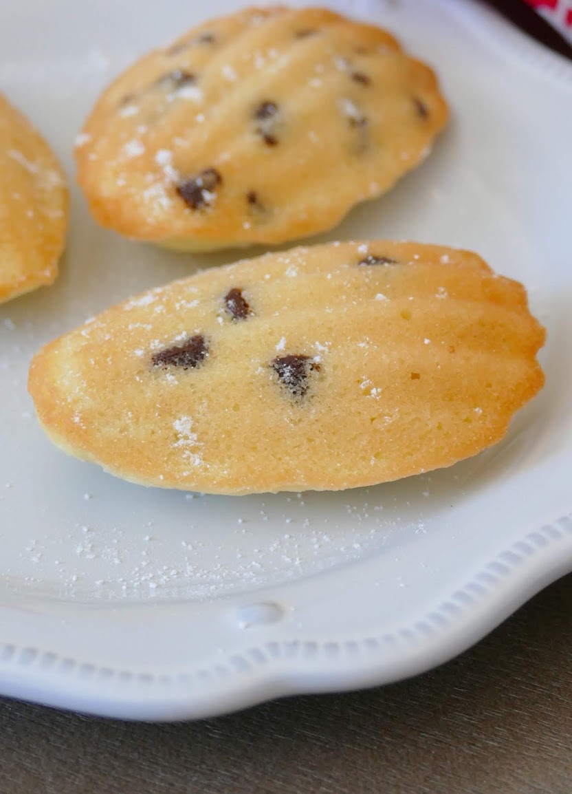 Mini Chocolate Chip Madeleines Recipe from Hot Eats and Cool Reads! These delicious little cake cookies are wonderful for any occasion! We love serving them at holiday parties, for snack or dessert! Also great with mint, butterscotch or white chocolate chips!