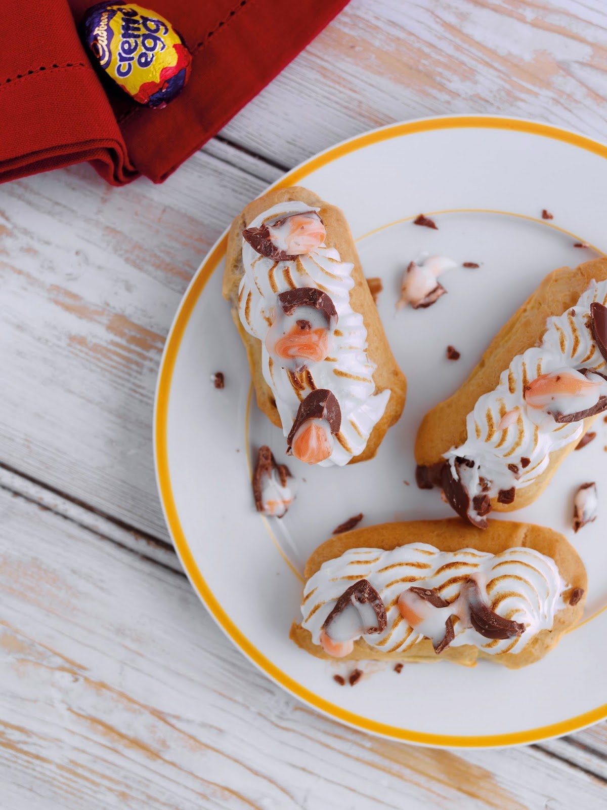 Mini Meringue Eclairs With Cadburys Creme Egg Filling
