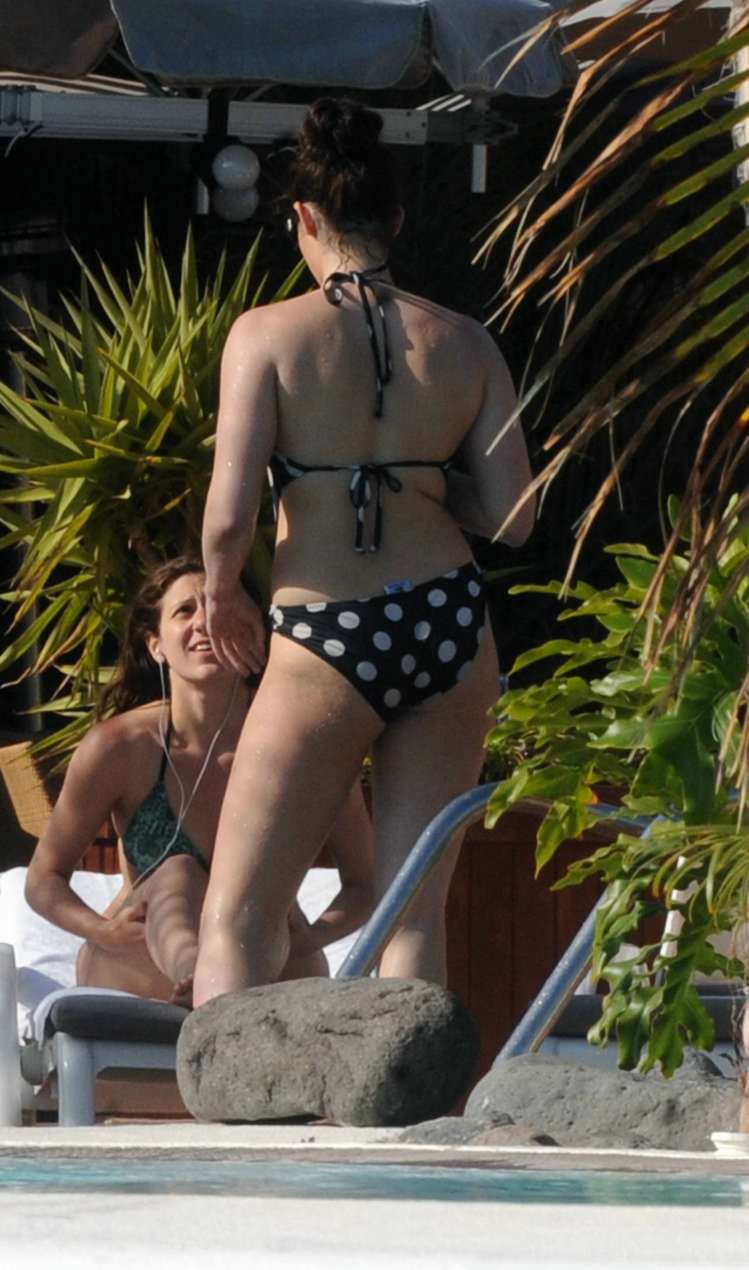 Gemma Arterton sexy starlet showing off her ass poolside in a bikini.