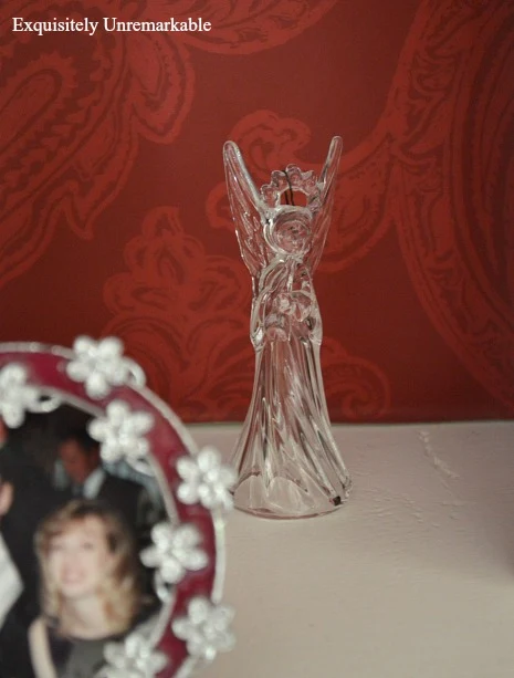 Mikasa Crystal Angel Ornament on built in shelves