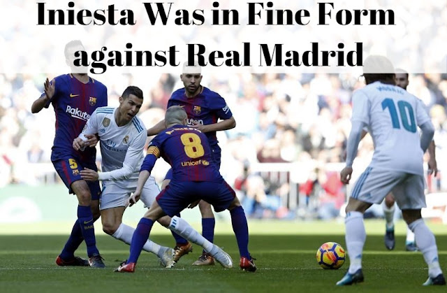 Andres Iniesta surrounded by Real Madrid players in the victory against Real Madrid at Santiago Bernebeu