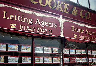 Cooke & Co gold leaf lettering on the shop front.
