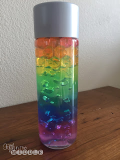 Water bottle containing rainbow colored water beads