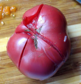skinning a summer heirloom tomato