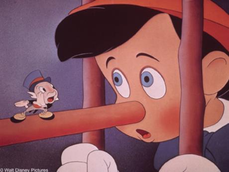 Jiminy Cricket stands on the boy's nose in Pinocchio 1940 animatedfilmreviews.filminspector.com