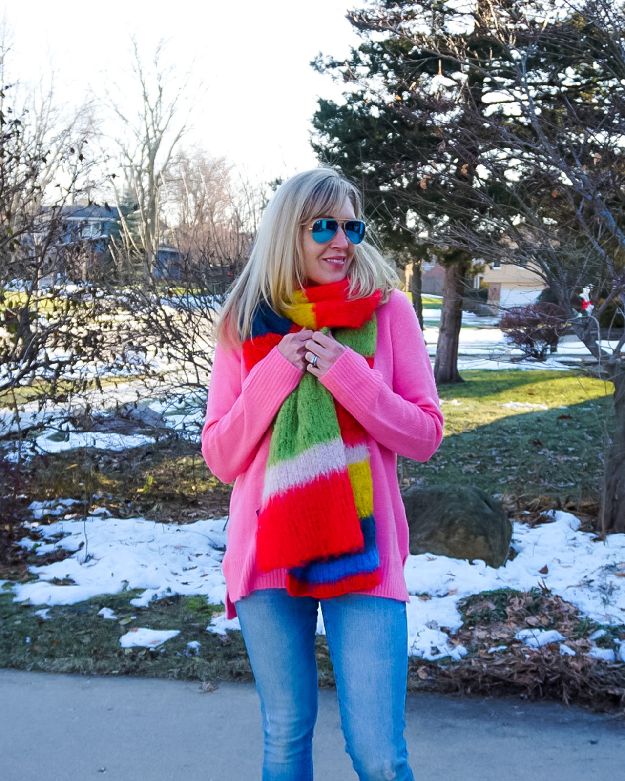 rainbow scarf with bright pink sweater