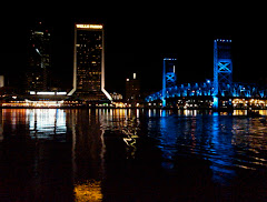 JAX Landing at night from across the St. John's River. Hyatt is to the right of the bridge.